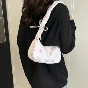 Sweet floral canvas shoulder bag for women with cute bow strap and chic crossbody design.
