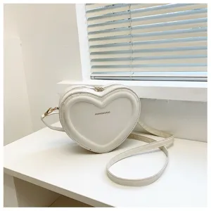 White heart-shaped crossbody bag sweet style shoulder bag for women daily fashion use.
