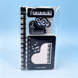 Piano music theme stationery set including notebook and pencils, perfect student gift.