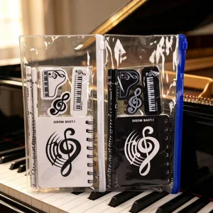 Music theme stationery set detail, transparent pencil pouch with cute piano note notebooks.