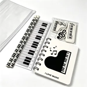 Piano note stationery set including pencil case, pencils, ruler, erasers and notebook.