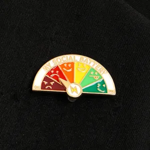 Close-up of sliding metal social battery brooch pin with colorful emoji moods