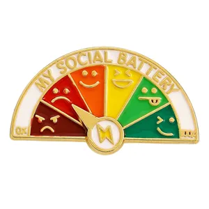 Close-up detail of slidable My Social Battery enamel pin with colorful mood emojis
