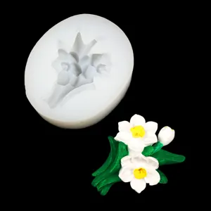 Daffodil silicone mold detail view showing the flexible white mold and detailed flower craft.