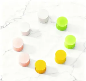 Colorful silicone ear plugs and gauges, flexible solid body piercing jewelry detail view.