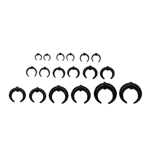Detailed view of black crescent ear stretchers body piercing taper sizing kit set.