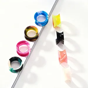 Colorful silicone ear gauges set, flexible piercing stretchers for fashion body jewelry styling.
