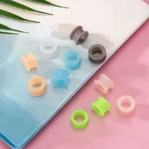 Colorful silicone ear tunnels and plugs, flexible body piercing jewelry in multi pastel solid colors.