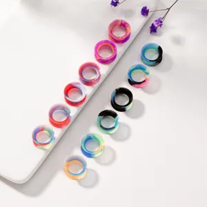 Colorful silicone ear tunnels and gauges detail shot, flexible body piercing jewelry.