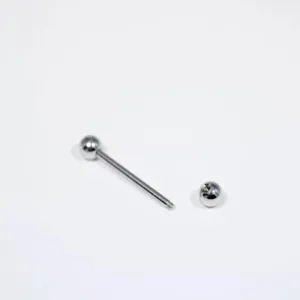Stainless steel straight barbell body piercing jewelry detail view, screw ball closure.