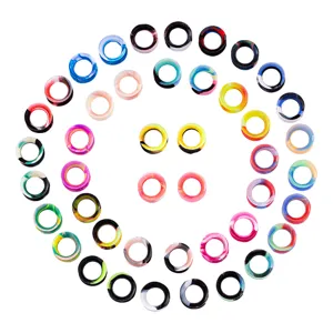 Colorful silicone ear plugs and tunnels detail, flexible circular piercing jewelry style.