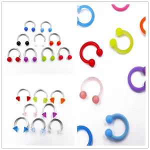 Stainless steel and acrylic horseshoe circular barbell body piercing rings in various colors.