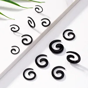 Black acrylic spiral ear stretchers and tapers set for cool fashion body piercing style.
