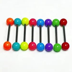 Close-up detail of colorful acrylic barbell tongue rings featuring stainless steel straight piercing bars.
