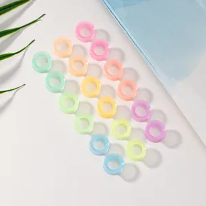Silicone glowing ear plugs detail close-up, colorful flexible body piercing jewelry for daily wear.