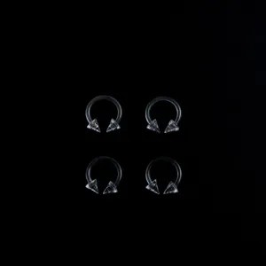 Clear acrylic horseshoe piercing rings detail view, transparent body jewelry set.