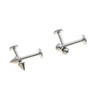 Titanium body piercing labret stud detail shot featuring interchangeable cone and round ball tops.
