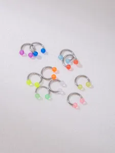 Stainless steel horseshoe piercing rings with colorful acrylic balls for nose and body.