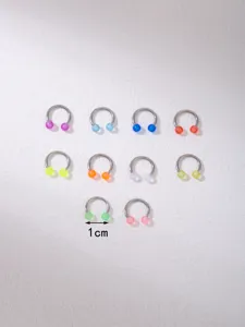 Stainless steel horseshoe ring with acrylic luminous balls, detailed view showing various colors and 1cm.