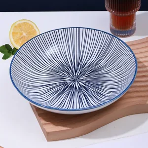 Assiette plate en céramique de style japonais rayures radiales bleues vaisselle