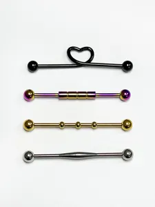 Set of 4 stainless steel industrial piercing barbells with heart and bead designs.