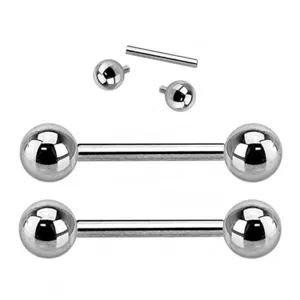 Titanium body piercing barbell detail, tongue and lip ring with spare balls and bars.