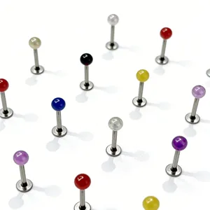 Stainless steel pearlescent labret stud piercing jewelry detail, multicolored body piercing rings.