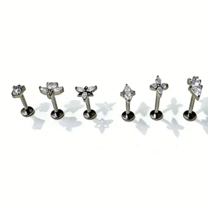 Titanium flat back labret studs with sparkling cubic zirconia, detail view of 6 pieces.