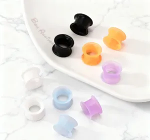 Colorful silicone ear tunnels and flexible flesh plugs for cool body piercing decoration.