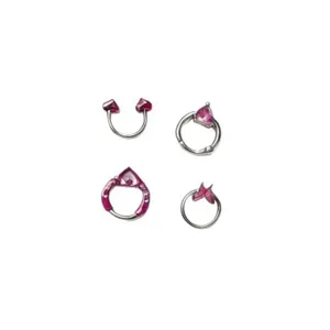 Close-up detail of pink heart piercing jewelry, hinged septum ring and horseshoe ring set.