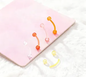 Flexible colorful acrylic curved barbell eyebrow piercing jewelry in sweet candy colors.