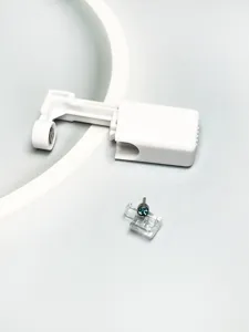 Disposable piercing tool detail view, body piercing auxiliary equipment with blue crystal stud.