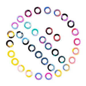 Close-up detail of colorful silicone ear tunnels and plugs showing flexible double flared design.