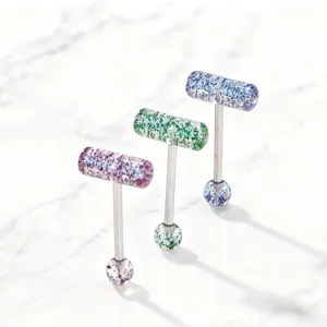Details of T-shaped capsule tongue rings with stainless steel bars and glitter acrylic.