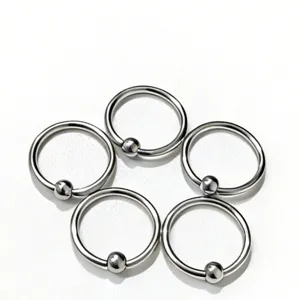Stainless steel captive bead ring set, detailed view of body piercing jewelry items.