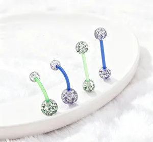 Acrylic glitter body piercing jewelry, detail view showing colorful uv soft bar belly rings.