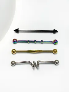 Detailed view of punk style industrial barbell piercing jewelry set, stainless steel ear cartilage studs.