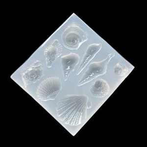 Clear silicone seashell mold detail view showing various marine conch cavities for resin.