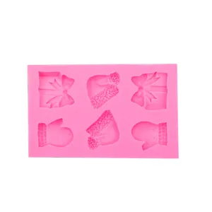 Silicone Christmas fondant mold with gift box, hat and glove shapes for baking decoration.