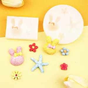 Detailansicht niedlicher Silikonformen mit Kaninchen und Seesternen fuer Backen und Basteln.