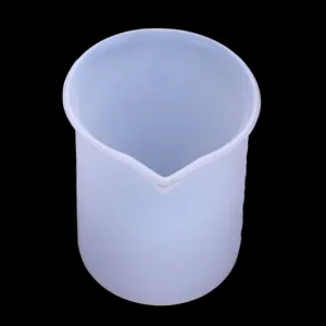 Detailed close-up of the translucent silicone measuring cup, showing clear material texture.