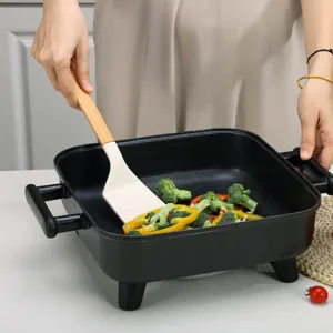 Siliconen spatel en antiaanbaklaag elektrische koekenpan set voor dagelijks koken.