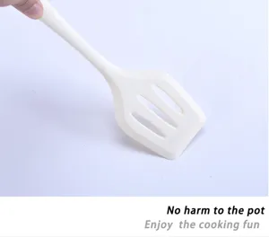 Heat-resistant silicone kitchen spatula with slotted design, perfect for non-stick cookware.