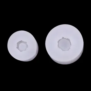 Silicone mold detail showing white round cake roll and cone base for baking and decorating.