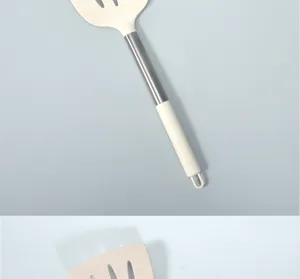 Large silicone slotted spatula with stainless steel handle, heat-resistant cooking tool.