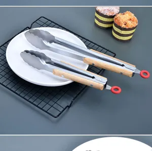 Stainless steel food tongs with wooden handles, perfect for outdoor BBQ, camping and daily home cooking.