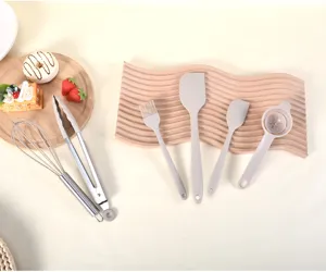 Silicone kitchen utensils detail view showcasing spatula brush and whisk set for daily baking.