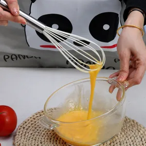Silicone egg whisk with stainless steel handle for baking, kitchen tool for beating eggs.