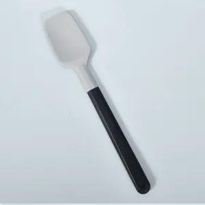 Detailed view of silicone spatula, dual-color handle for baking, cooking and kitchen use.
