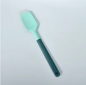 Silicone spatula with two-tone handle for baking, cooking, kitchen tool detail view.